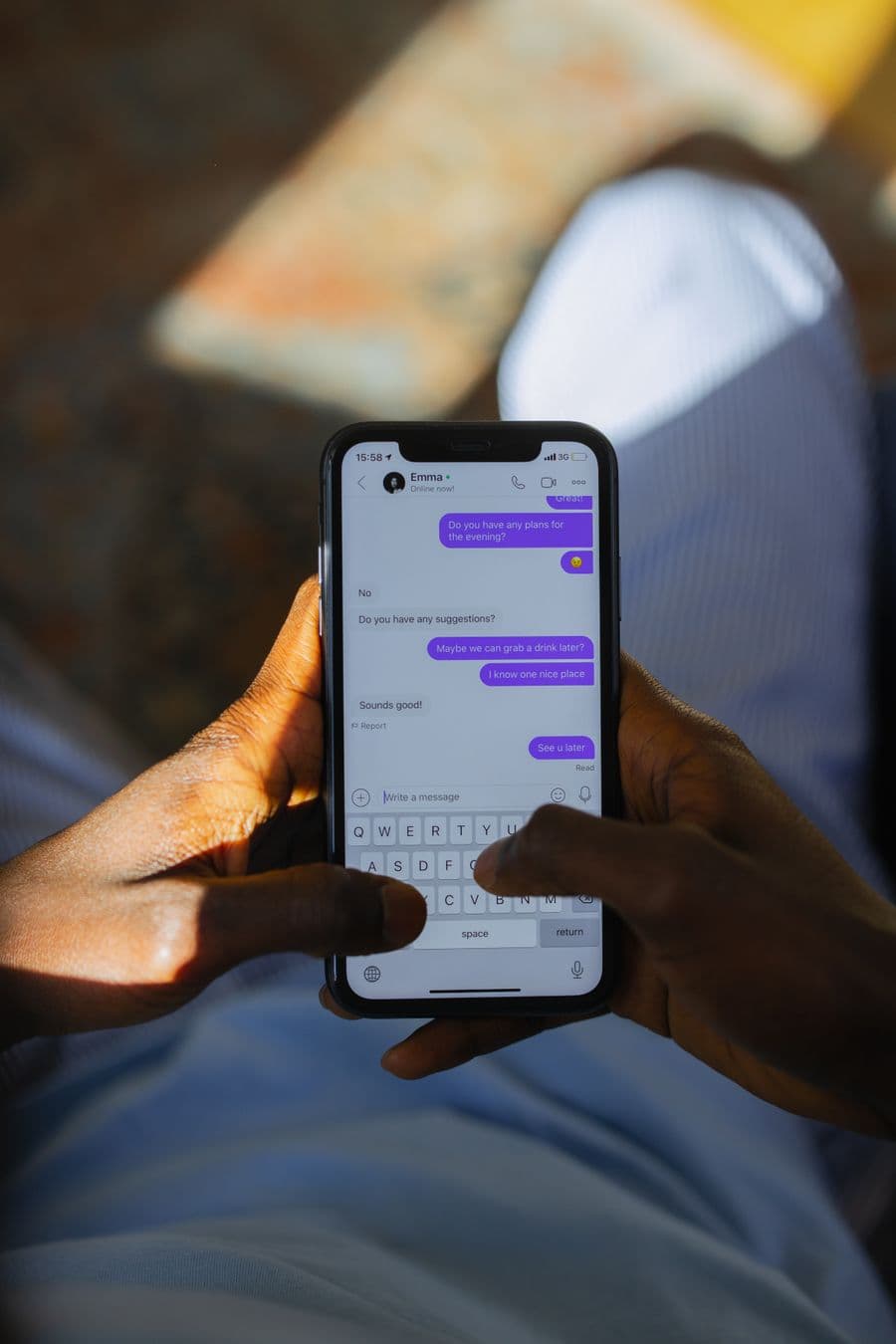 Customer chatting from their phone at night